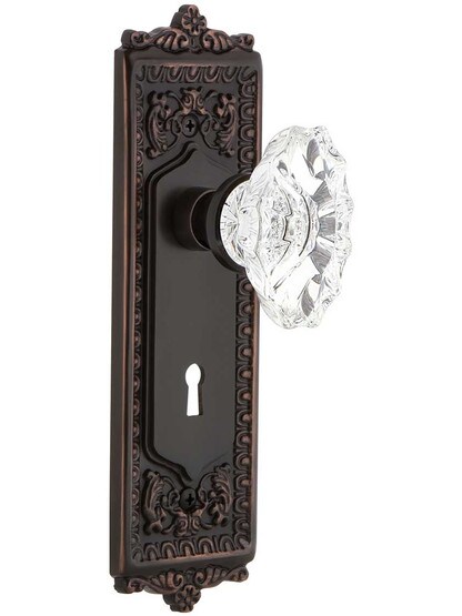 Egg and Dart Design Door Set with Keyhole and Chateau Crystal Glass Knobs in Timeless Bronze.